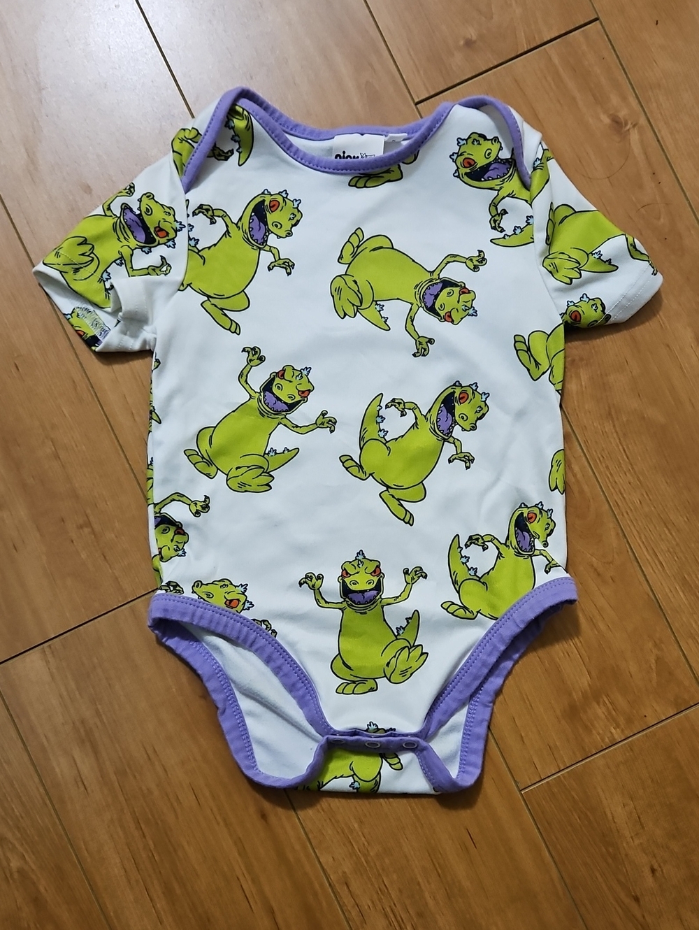 Baby One-Piece with Reptar Print and Lavender Trim
